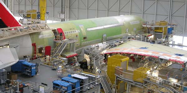 green aircraft in hangar