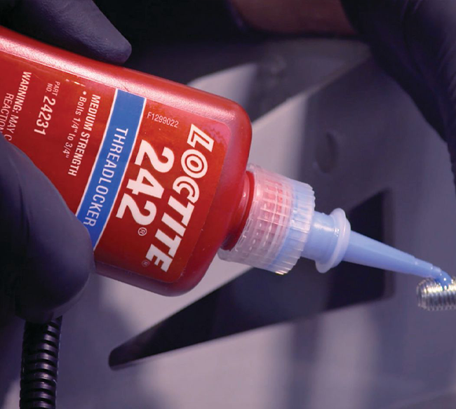 Loctite 242 bottle being use close up