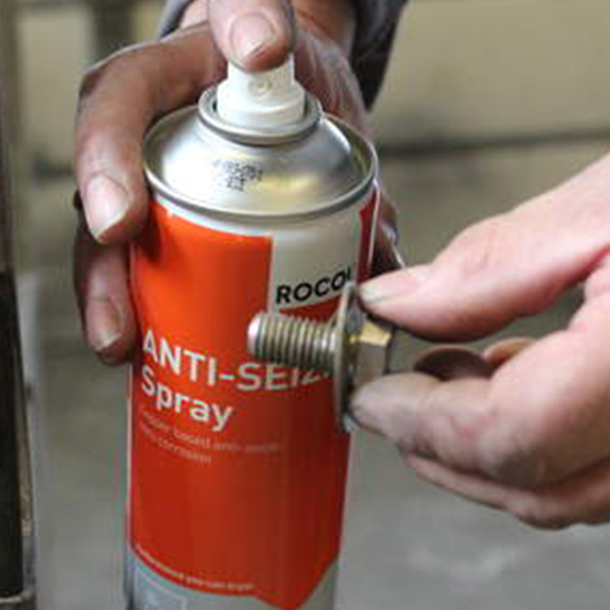 Anti-seize spray next to a bolt