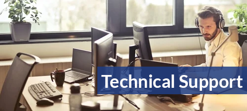 man at computer with headset on