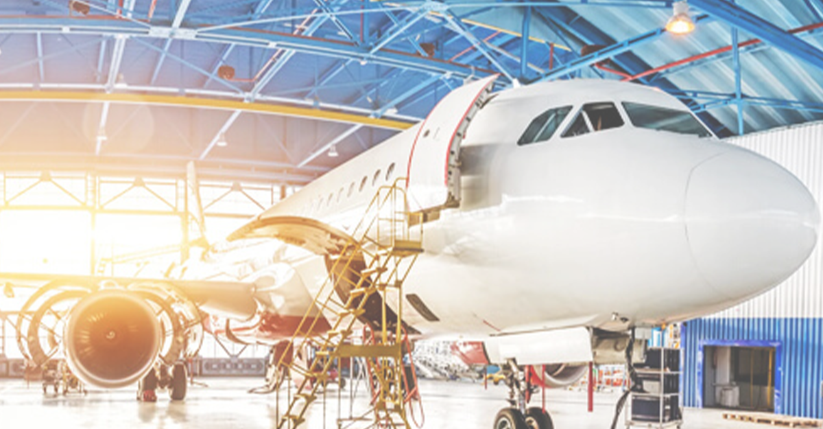 Various aircraft in hangar