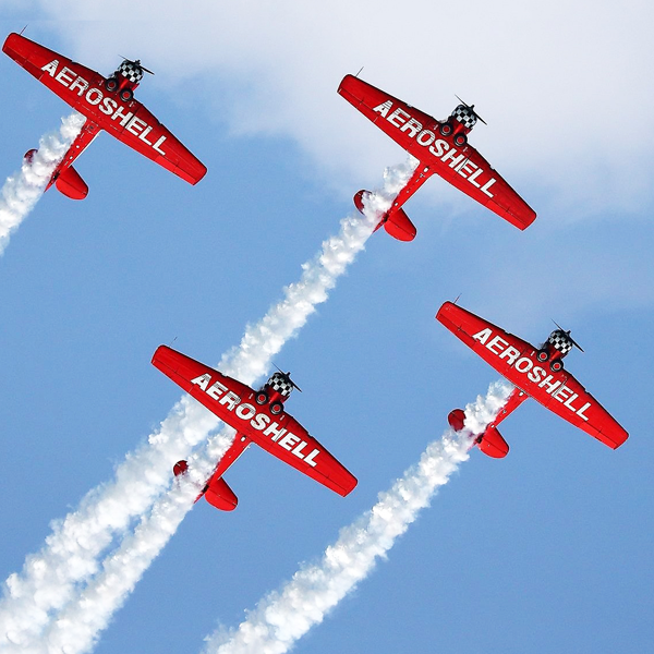 2 small Aeroshell aircraft in flight