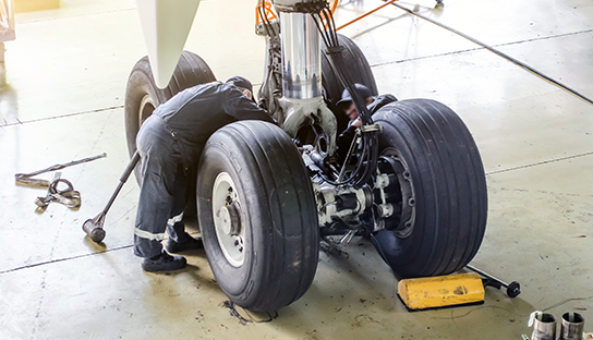 Man working on aircraft tyres
