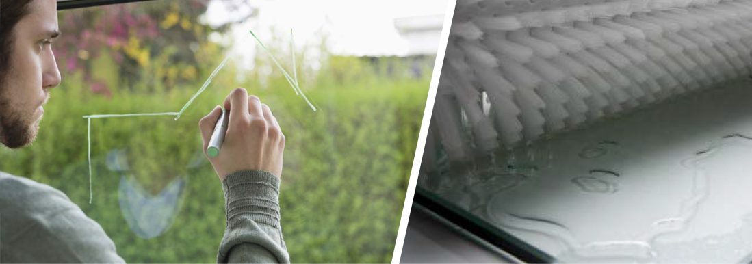 Person writing on glass with Chemetall product