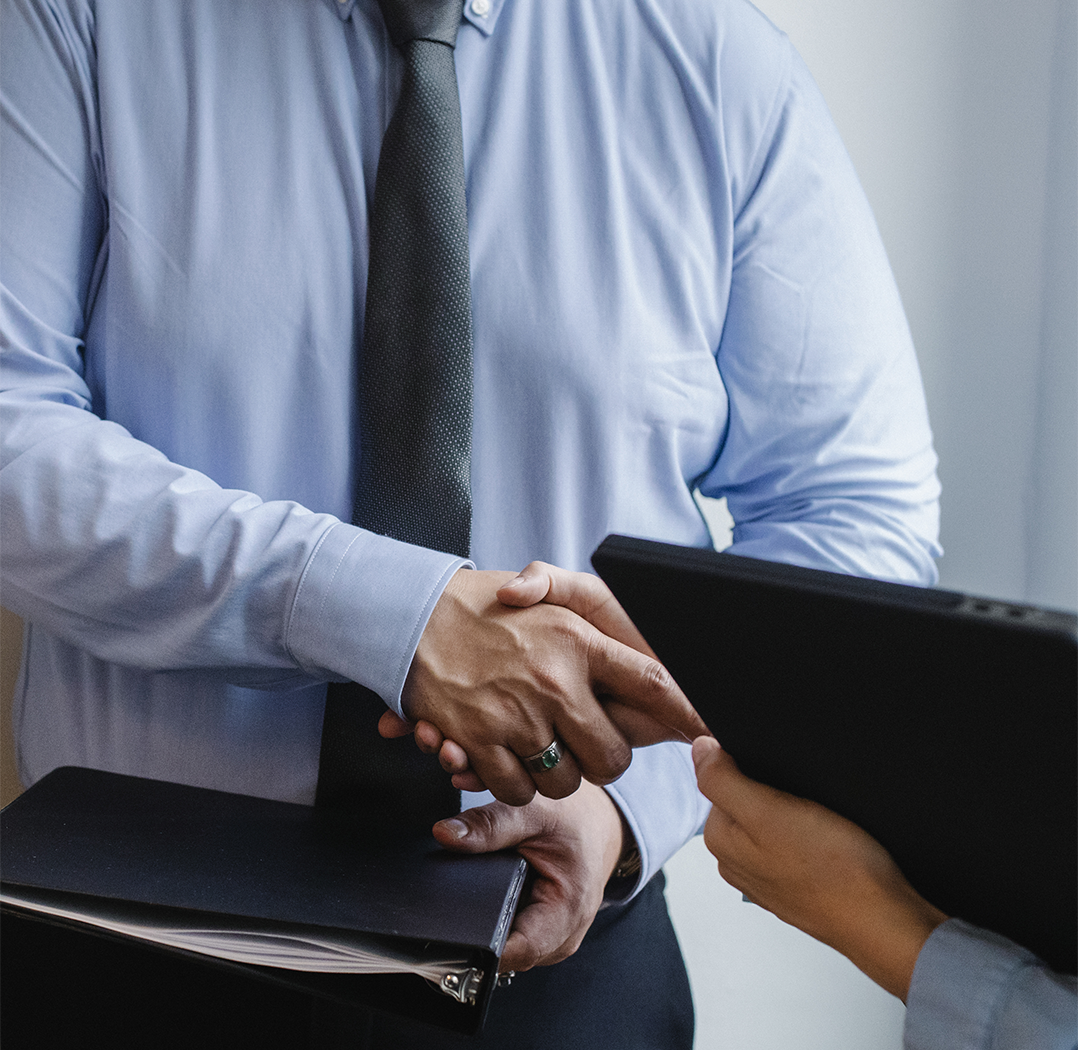 man in suit shaking hands