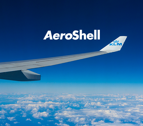 Aircraft above clouds with AeroShell logo