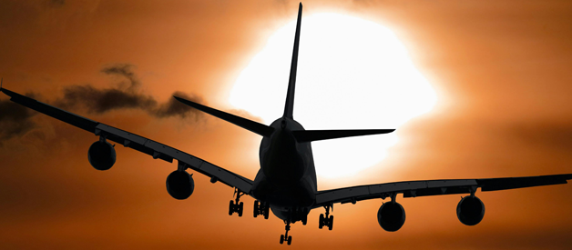 aeroplane silhouette against night sky
